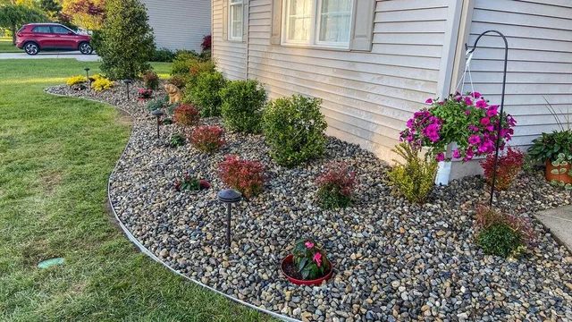 Decorative rock bed with landscape lighting