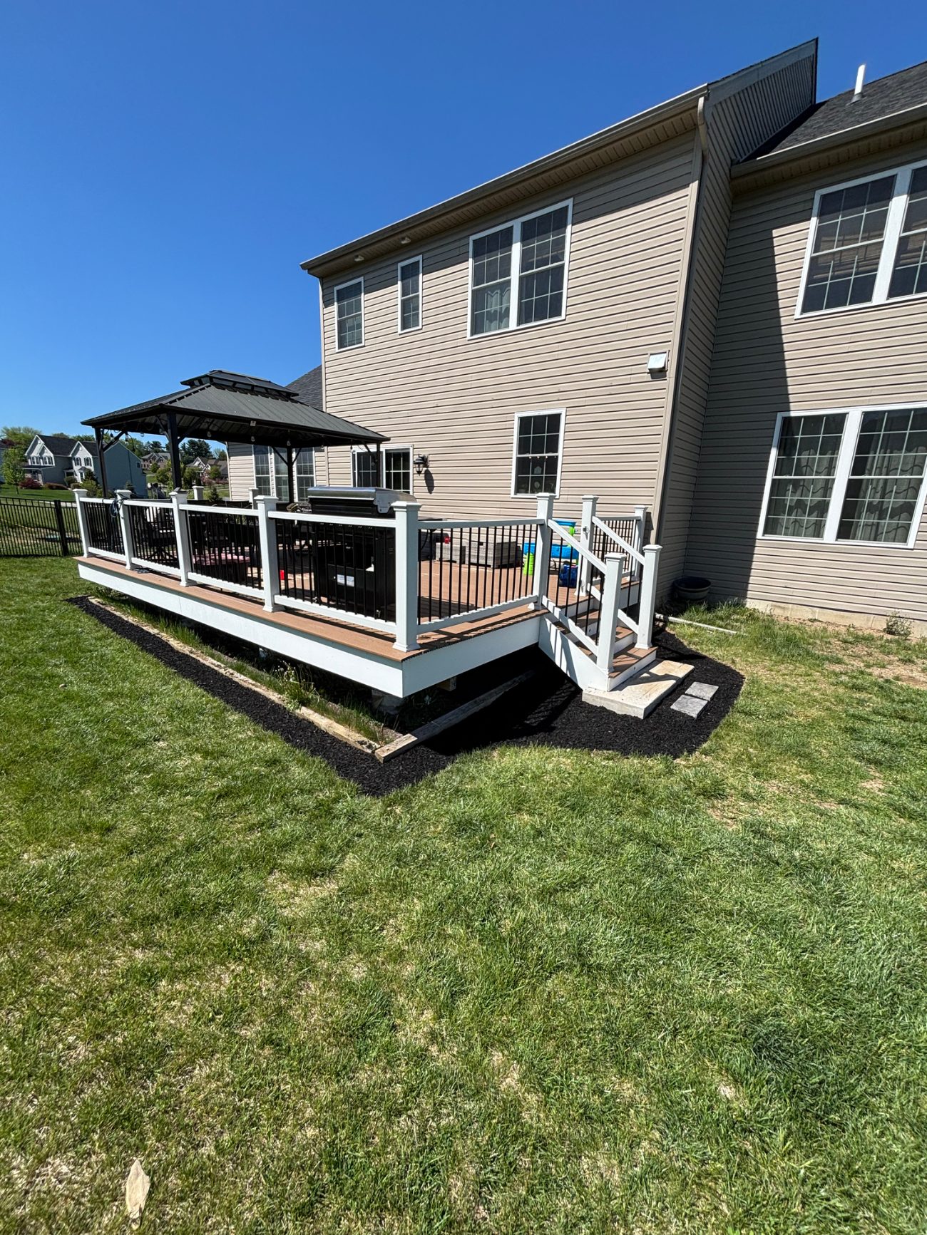 Backyard with raised deck and gazebo