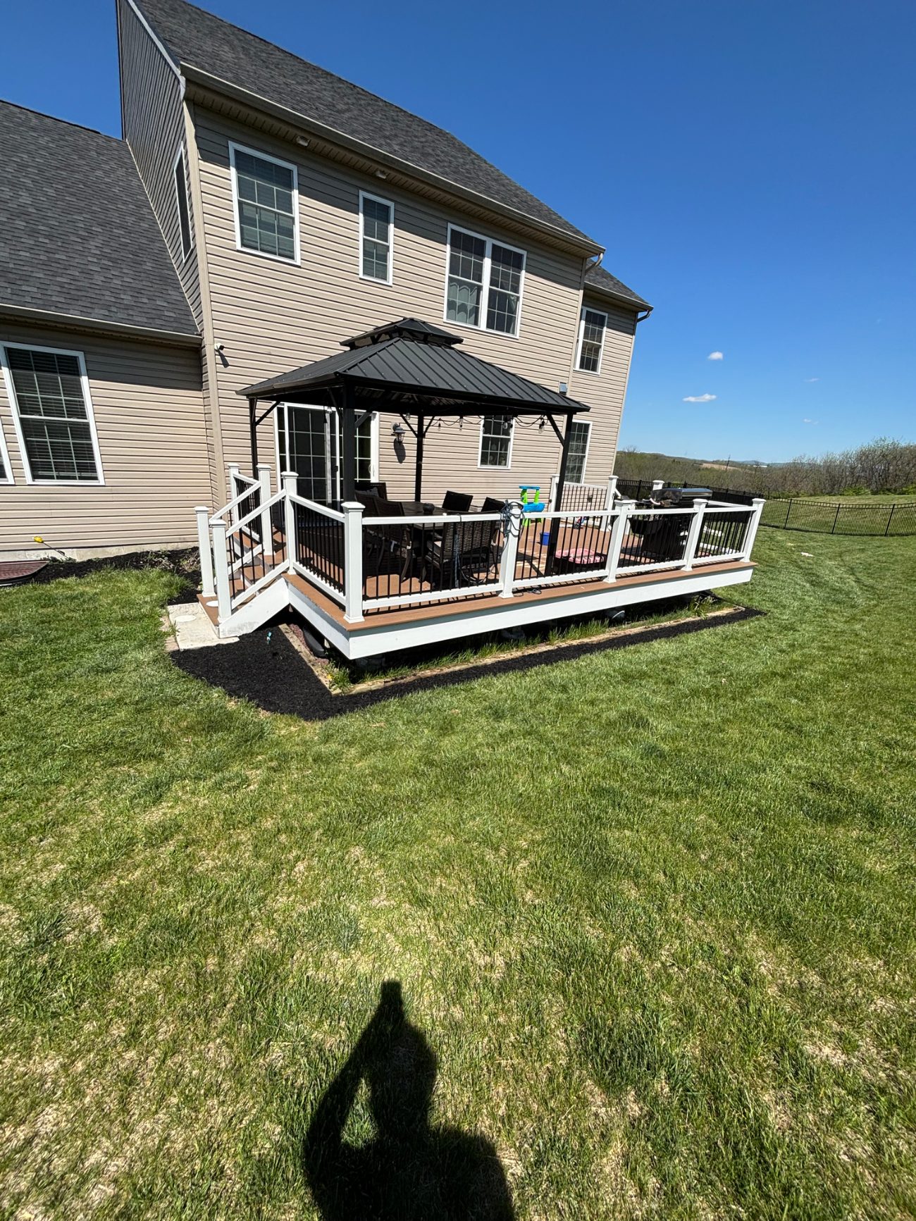 Backyard deck with gazebo and grill area