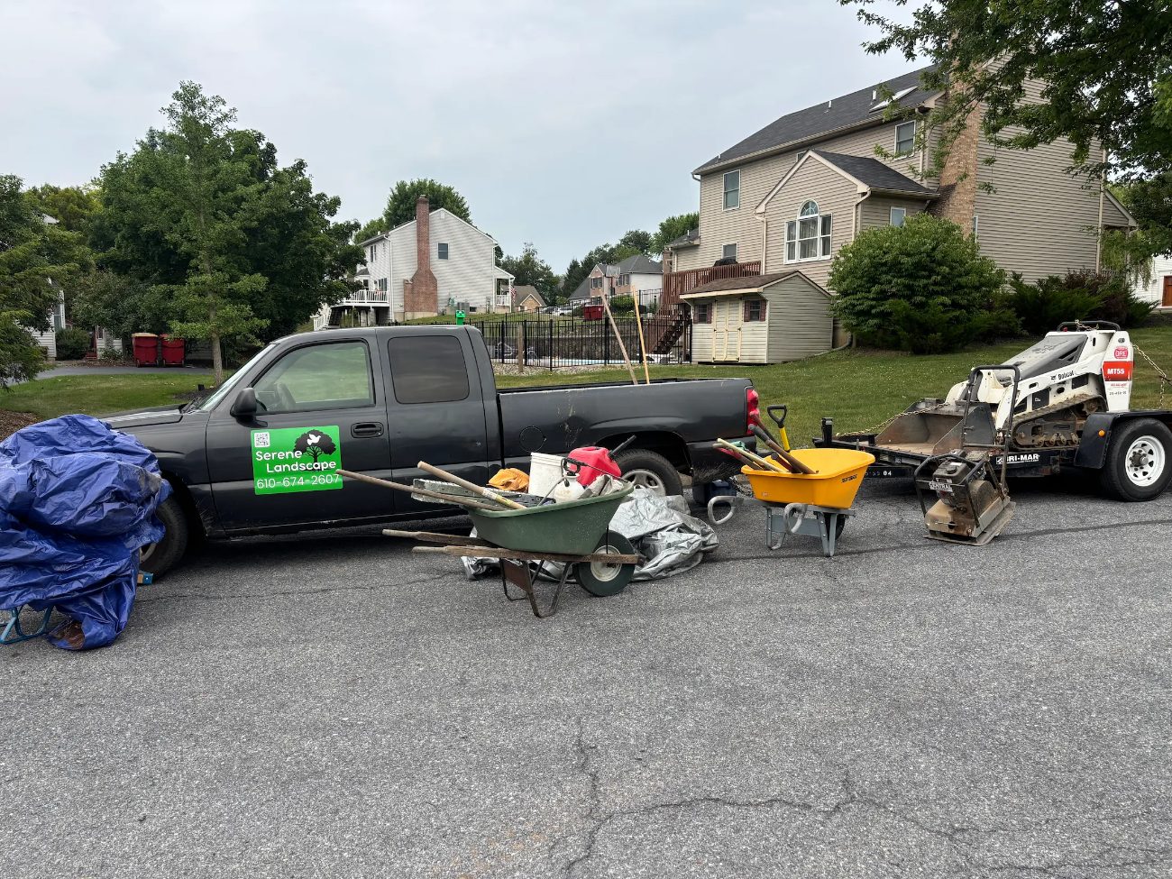Serene Landscaping truck and trailer loaded with equipment on the job